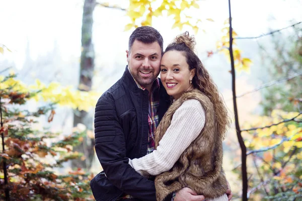 Nice couple having fun in autumn park — Stock Photo, Image