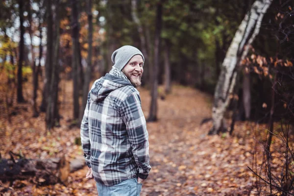 Young man in the autumn park — Stock Photo, Image