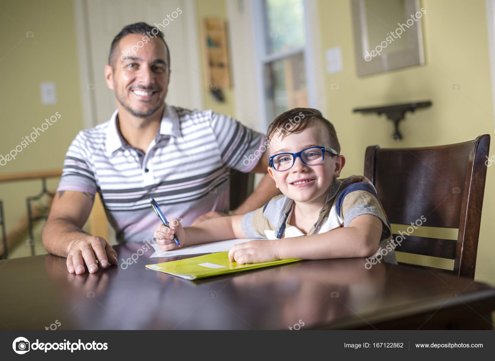 father helping son do homework parent helps his child stock photo parent helps
