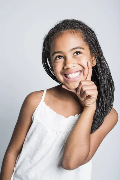 Adorable african little girl on studio gray background — Stock Photo, Image