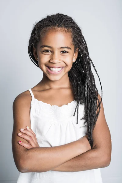 Adorable african little girl on studio gray background — Stock Photo, Image
