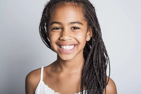 Adorable african little girl on studio gray background — Stock Photo, Image