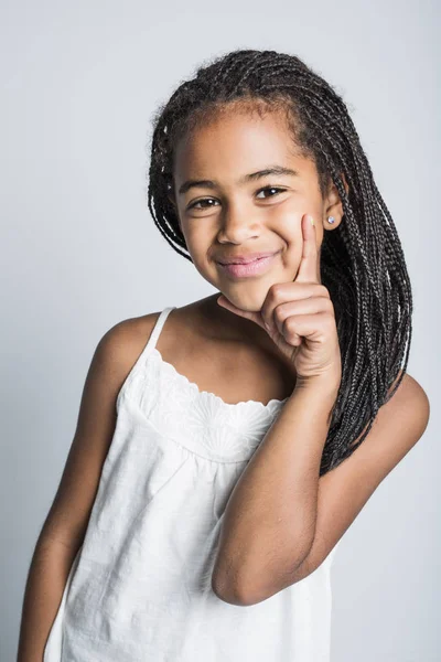 Adorable african little girl on studio gray background — Stock Photo, Image