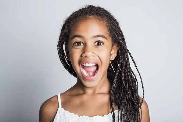 Adorable african little girl on studio gray background — Stock Photo, Image