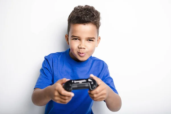 Young child having fun playing video games — Stock Photo, Image