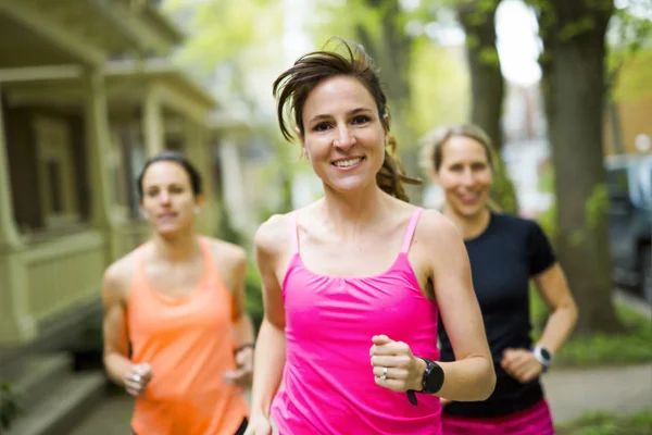 Group of people enjoying in the fitness having fun running outside — Stock Photo, Image