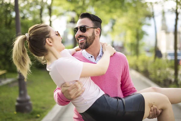 Picture of a joyful couple in a park road — Stock Photo, Image