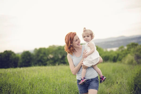 Young beautiful mother her little toddler daughter — Stock Photo, Image