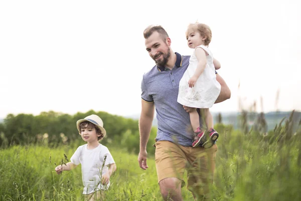 Happy young family on a walk — Stock Photo, Image