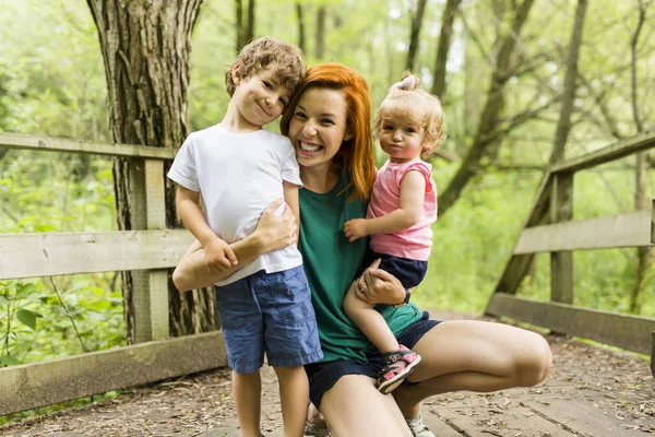 Young beautiful mother her little toddler daughter and son — Stock Photo, Image