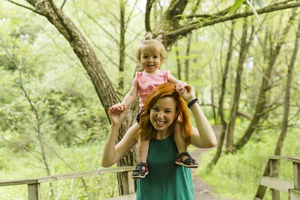 Daughter with mother on nature. — Stock Photo, Image