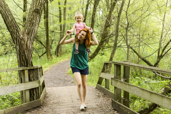 Daughter with mother on nature. — Stock Photo, Image