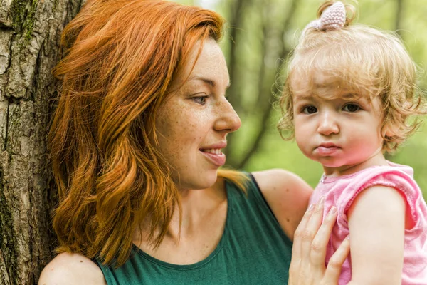 Daughter with mother on nature. — Stock Photo, Image