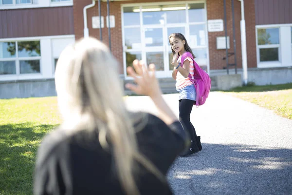 Mother daughter saying her goodbye for the day — Stock Photo, Image