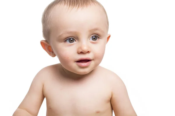 Niño bebé bebé niño feliz mirando a la esquina aislado sobre un fondo blanco — Foto de Stock