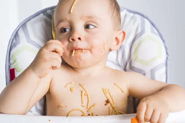 Little baby eating her dinner and making a mess — Stock Photo, Image