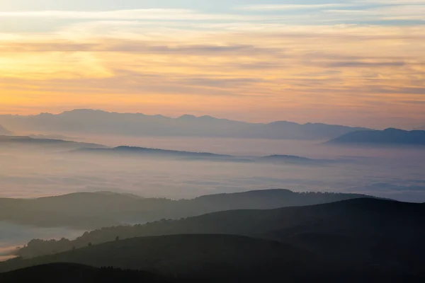 Mountain silhouette at sundown