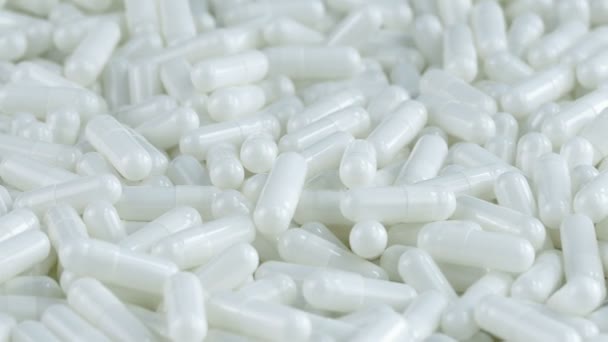 Kapsułki leku biały obrotowa — Wideo stockowe