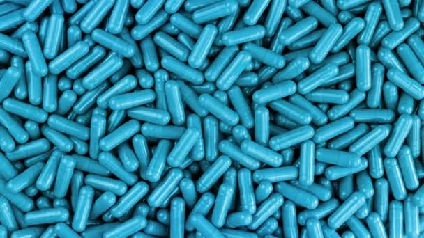 Blauwe Pharma Caps roterende stapel — Stockvideo