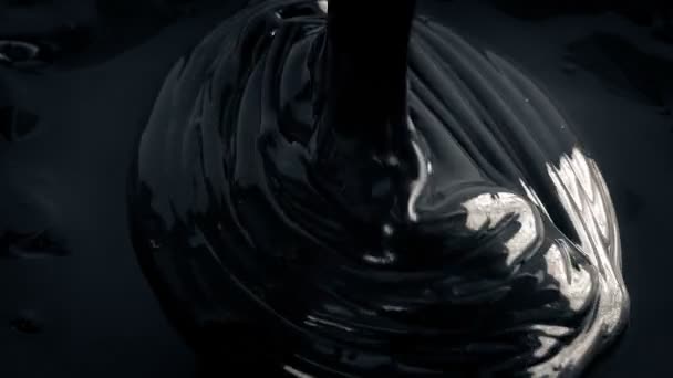 Black Paint Pouring Closeup — Stock Video