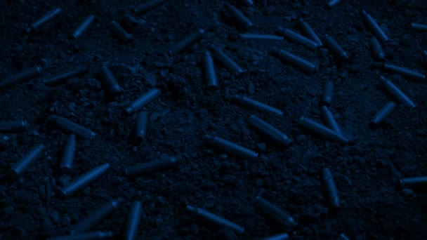 Moving Bullet Casings Ground Night — Stock Video