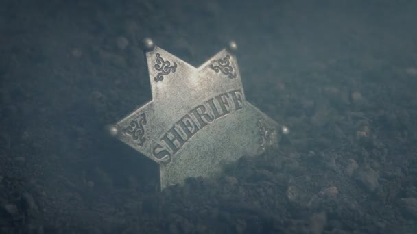 煙と地面に野生の西保安官バッジ — ストック動画