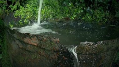 Rustic Water Feature With Old Metal Bucket