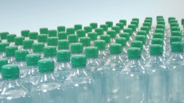 Man Puts Water Bottle On Table For Sports Event