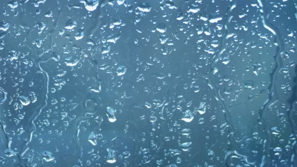 Regn Som Springer Ner Genom Fönstret — Stockvideo