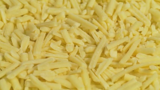 Grated Cheese Turning Slowly Closeup — Stock Video
