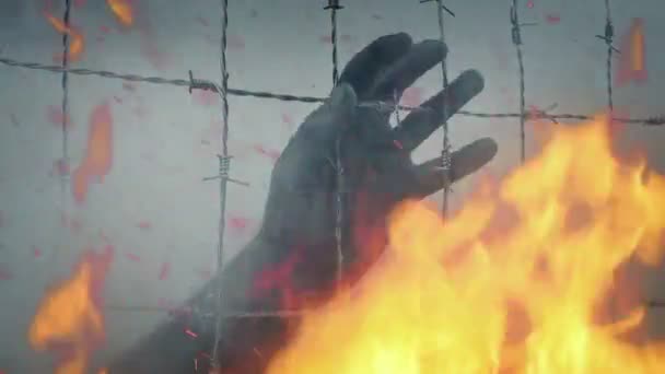 Hand Grasps Barbed Wire Raging Fire — Stock Video