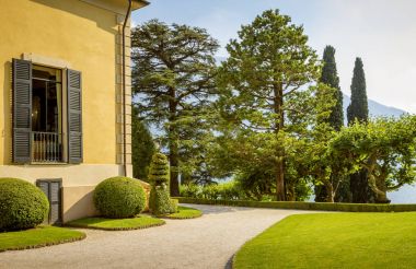 Panorama of garden and villa at lake Como in Italy clipart