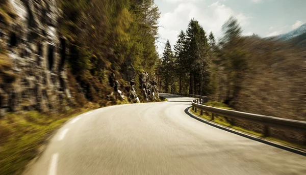 Mountain road at high speed motion blur — Stock Photo, Image