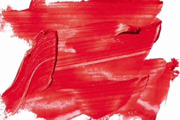 Härligt mättade röda läppstift på vit bakgrund. — Stockfoto