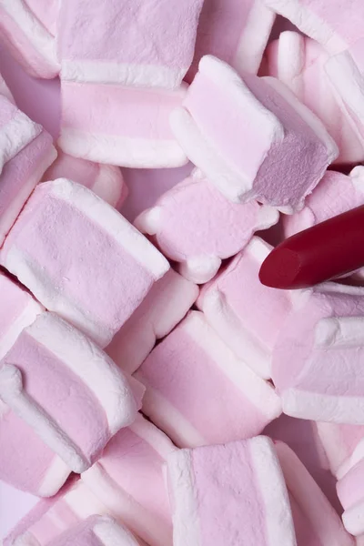 Red lipstick on a background of sweets — Stock Photo, Image