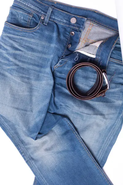 蓝色牛仔裤躺在白色的 Backgroundd — 图库照片