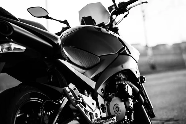 Black sports motorcycle close-up on the street.