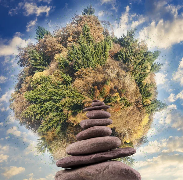 Stacked rocks with a planet — Stock Photo, Image