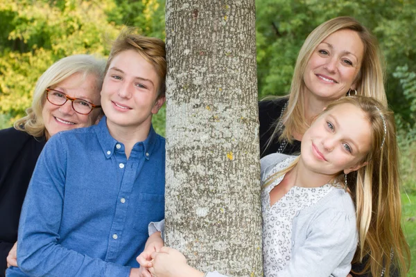 Mother and grand mother at park and children