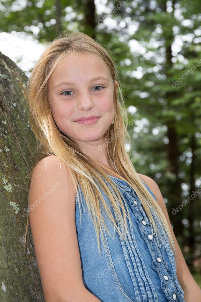 Lovely young blond girl with long hair Stock Photo by ©OceanProd 128675338
