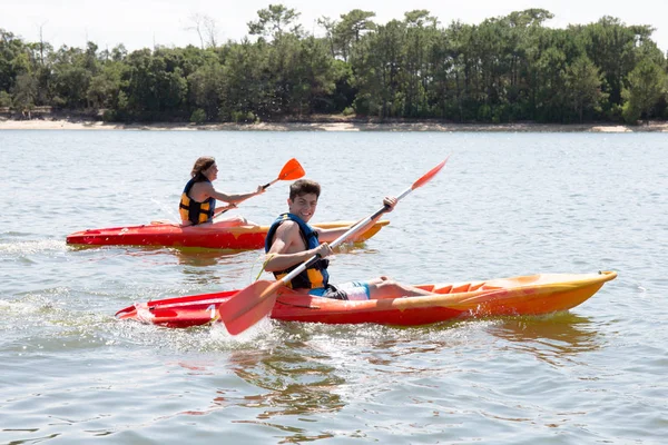 Two kayak making tourism in the calm river — Stock Photo, Image