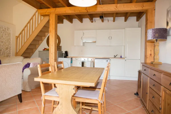 Wood table in white kitchen in an old house — Stock Photo, Image