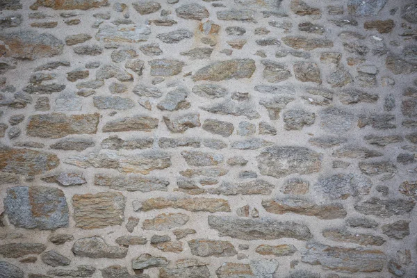 Steinmauer eines alten Hauses in der Bretagne nützlich für eine Tapete oder Hintergrund — Stockfoto