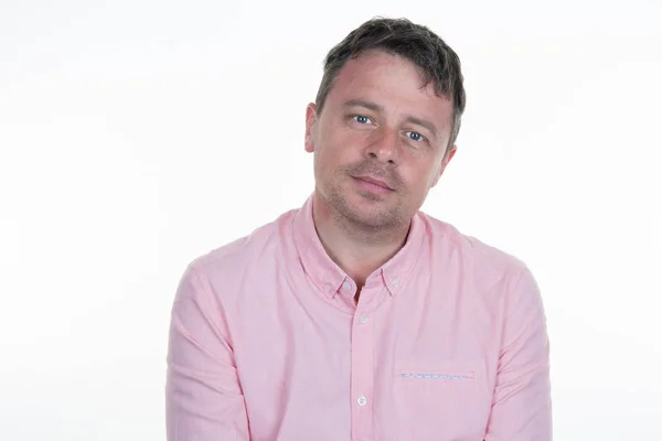 Portrait of a thirties man with a pink shirt on a white background — Stock Photo, Image