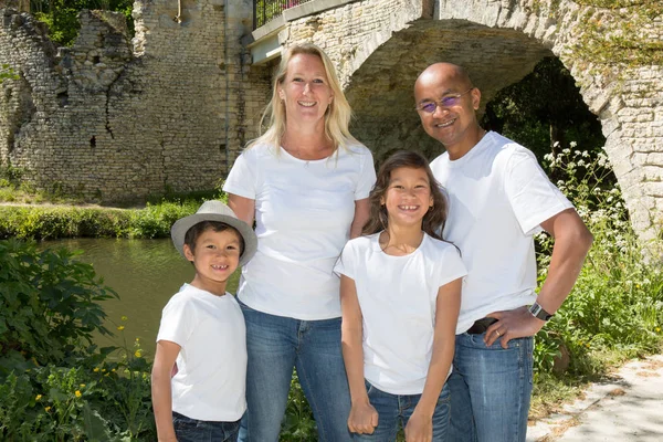 mixed family with two children daughter and boy and a blonde mother with a father of asian Indian origin
