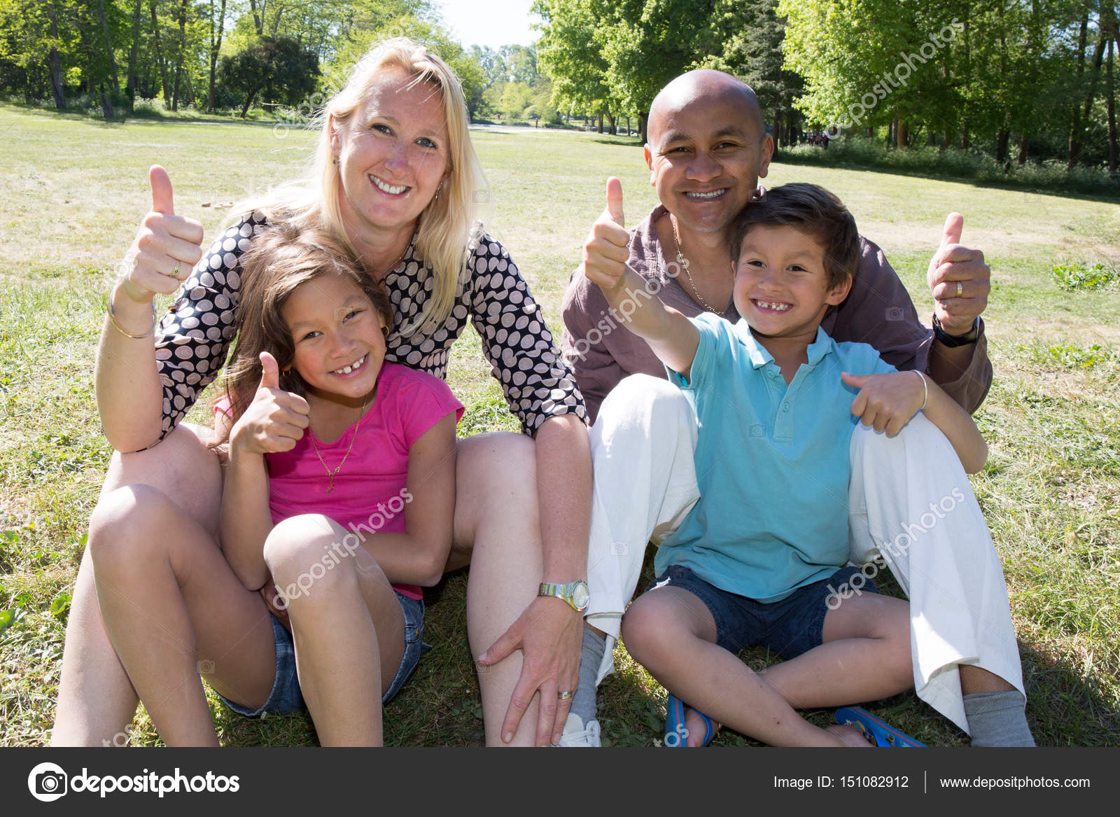 Mixed multiracial family with everyone with their thumbs up to say it is great — Stock Photo