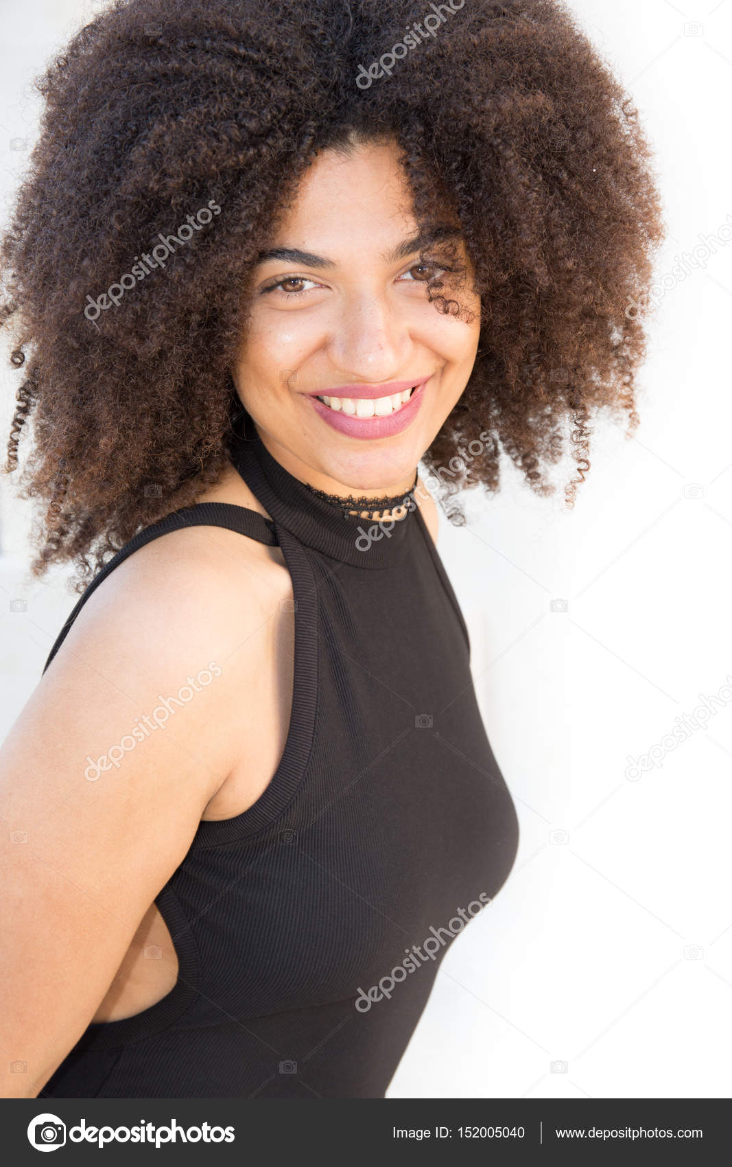 Mixed Beautiful Model Girl In A Black Dress With Her Curly Hair