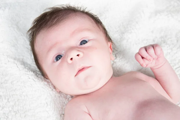 Newborn baby face in towels — Stock Photo, Image