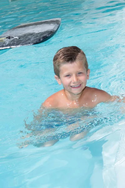 Child little boy swimming in the pool water — Stock Photo, Image