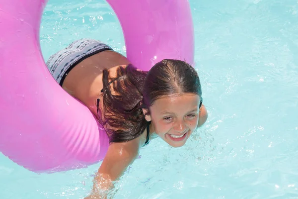 Kid girl in house swimming pool in summer day — Stock Photo, Image